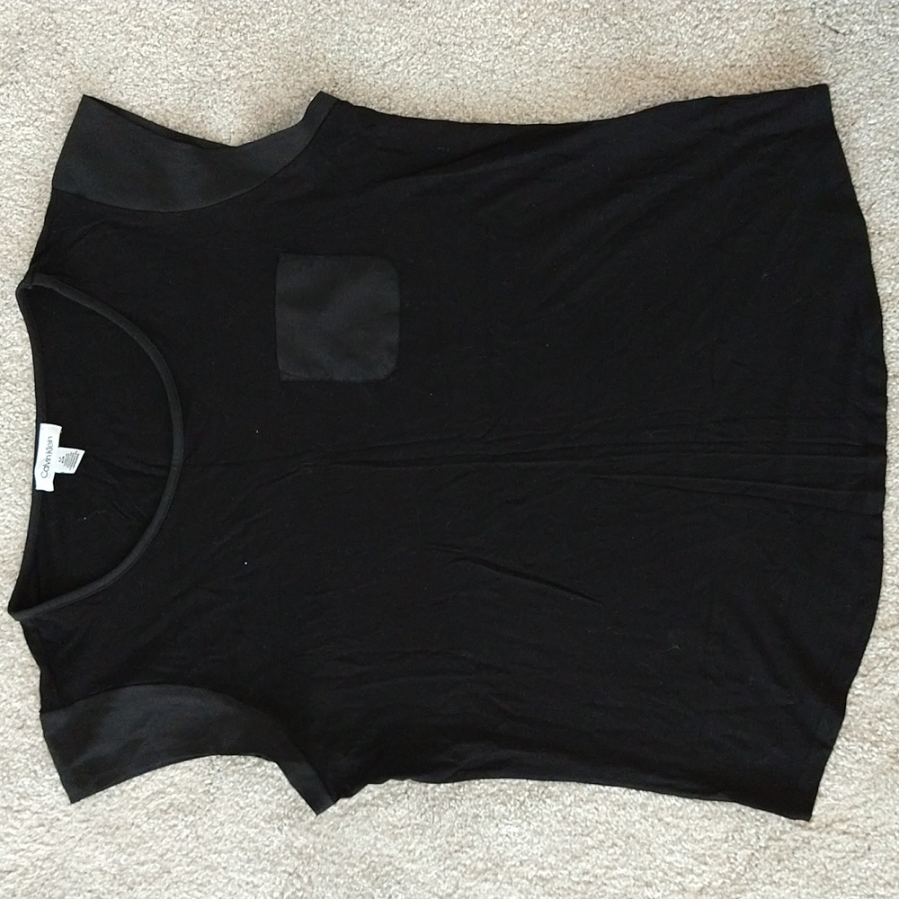 A Calvin Klein black dressy T-shirt size Large